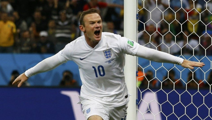 England&#039;s Rooney celebrates scoring against Uruguay during their 2014 World Cup Group D soccer match at the Corinthians arena in Sao Paulo