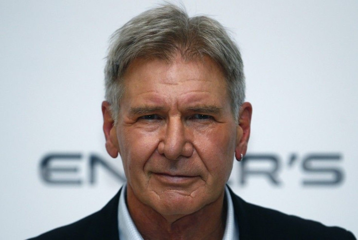 Actor Harrison Ford poses for photographers at a question and answer event 