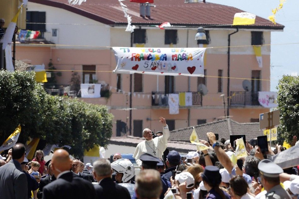 Pope Francis waves as he arrives to visit a cathedral in Cassano allo Jonio, southern Italy, June 21, 2014. REUTERSGiampiero Sposito ITALY - Tags RELIGION