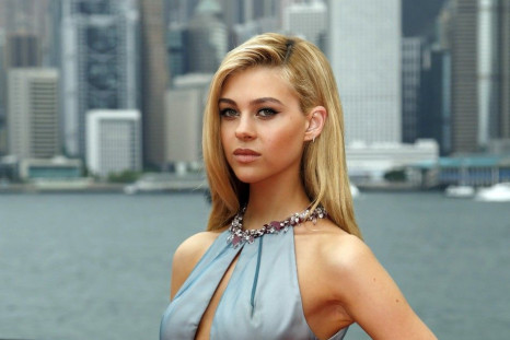 U.S. Actress Nicola Peltz Poses on the Red Carpet as She Arrives for the World Premiere of the Film 'Transformers: Age of Extinction' in Hong Kong