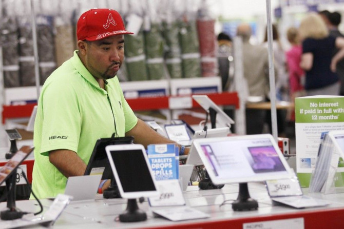 A customer pores over tablet computers at a Sam's Club