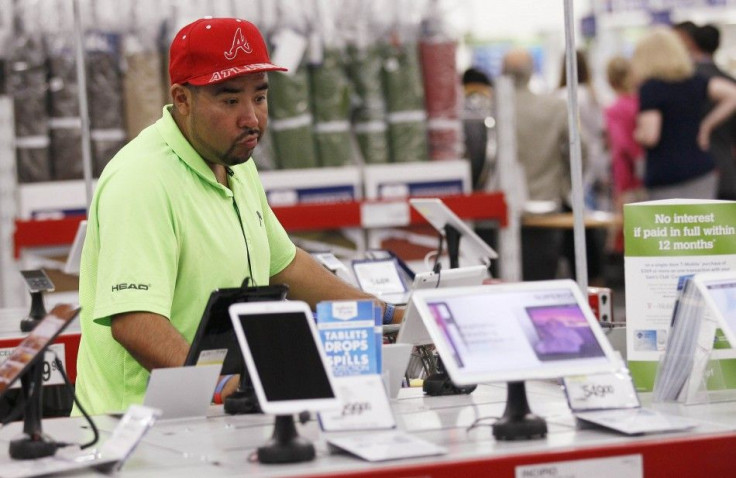 A customer pores over tablet computers at a Sam's Club