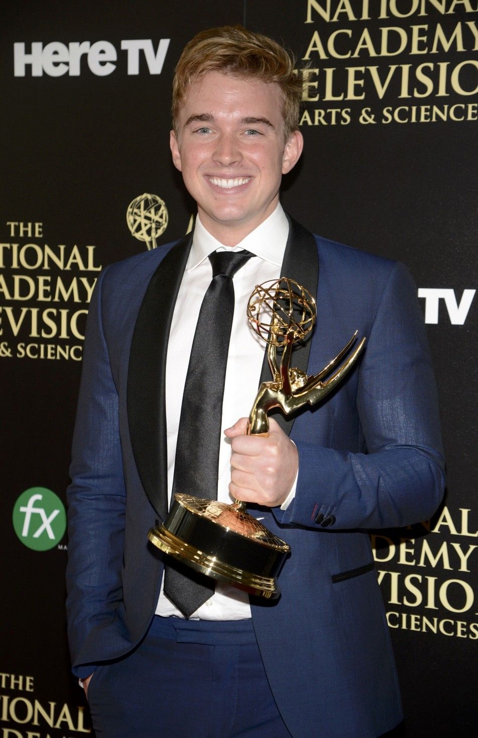 Chandler Massey Poses Backstage with the Award for Outstanding Younger Actor in a Drama Series for His Role in Days of Our Lives During the 41st Annual Daytime Emmy Awards in Beverly Hills
