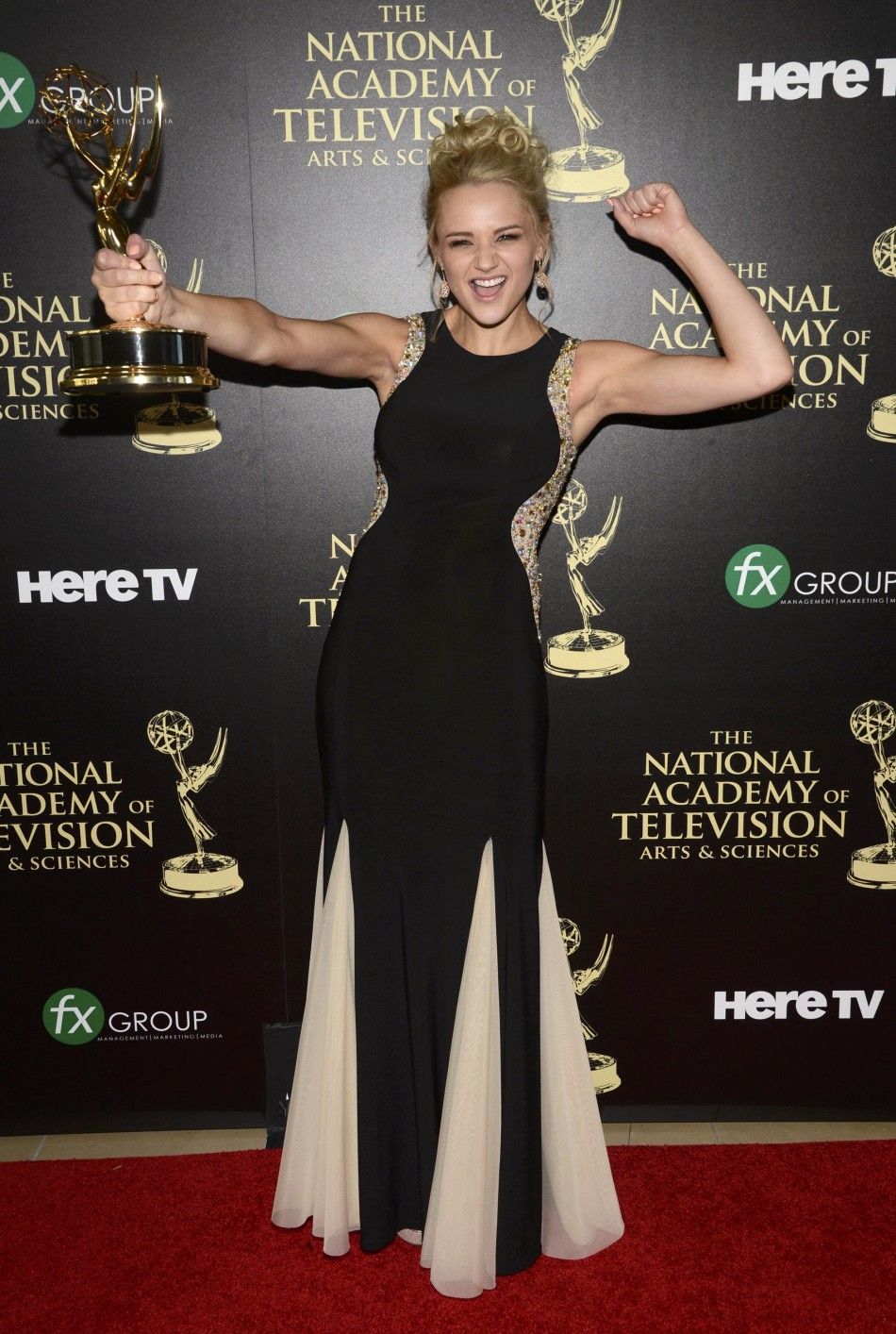 Hunter King Poses Backstage with the Award for Outstanding Younger Actress in a Drama Series for Her Role on The Young and the Restless During the 41st Annual Daytime Emmy Awards in Beverly Hills