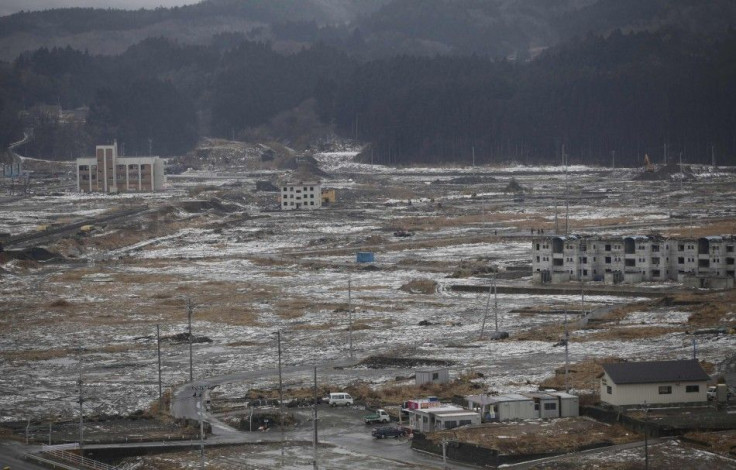 Snow falls over Minamisanriku town, devastated by the March 11, 2011 tsunami, in Miyagi prefecture, northeastern Japan in this February 23, 2012 file photo. To match Special Report JAPAN-LABOR/ REUTERS/Yuriko Nakao/Files (JAPAN - Tags: POLITICS BUSINESS E