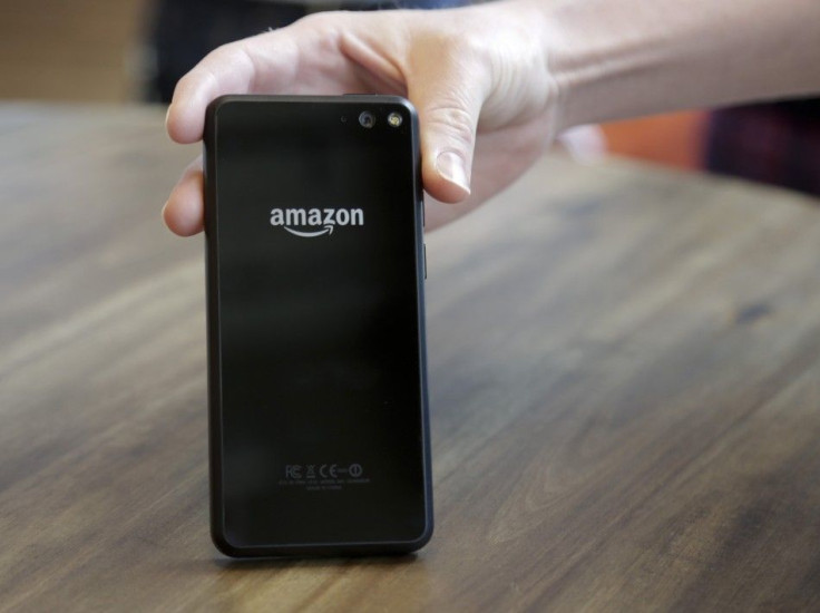 An Amazon representative shows off the company's new Fire smartphone at the company's campus in Seattle, Washington June 18, 2014. Amazon.com Inc's new cellphone seeks to offer shoppers instant gratification by recognizing thousands of prod
