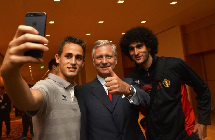 Belgium's King Philippe poses for a selfie with Januzaj and Fellaini after the team's 2014 World Cup Group H soccer match in Rio de Janeiro