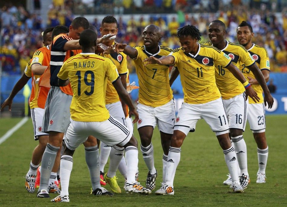 Colombias team celebrates  Juan Cuadrados 3rd R goal 