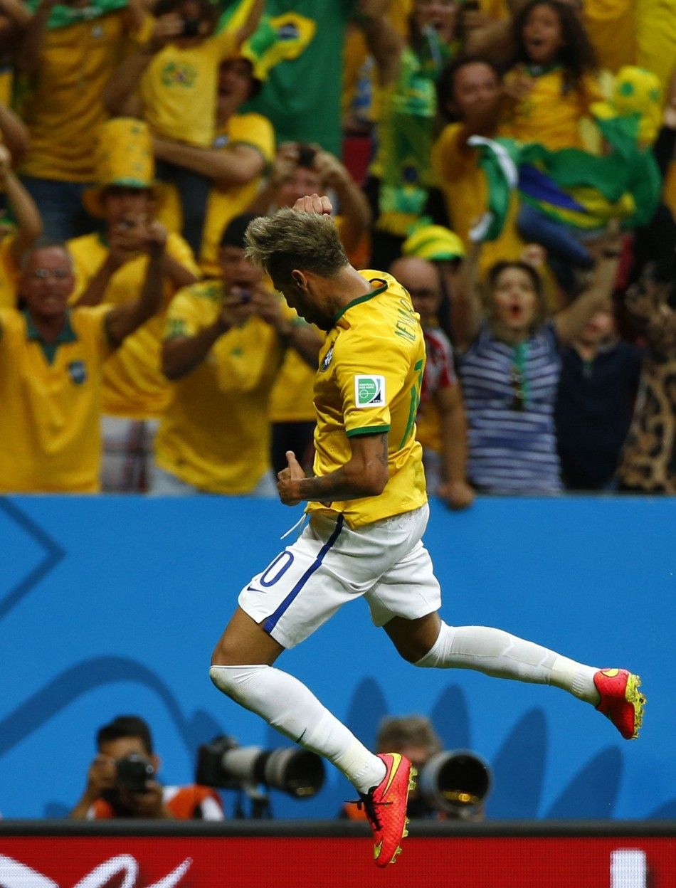 Brazils Neymar Celebrates Scoring His Second Goal Against Cameroon During Their 2014 World Cup Group A Soccer Match at the Brasilia National Stadium in Brasilia