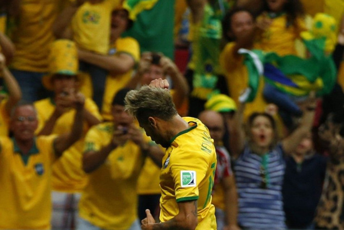Brazil's Neymar Celebrates Scoring His Second Goal Against Cameroon During Their 2014 World Cup Group A Soccer Match at the Brasilia National Stadium in Brasilia