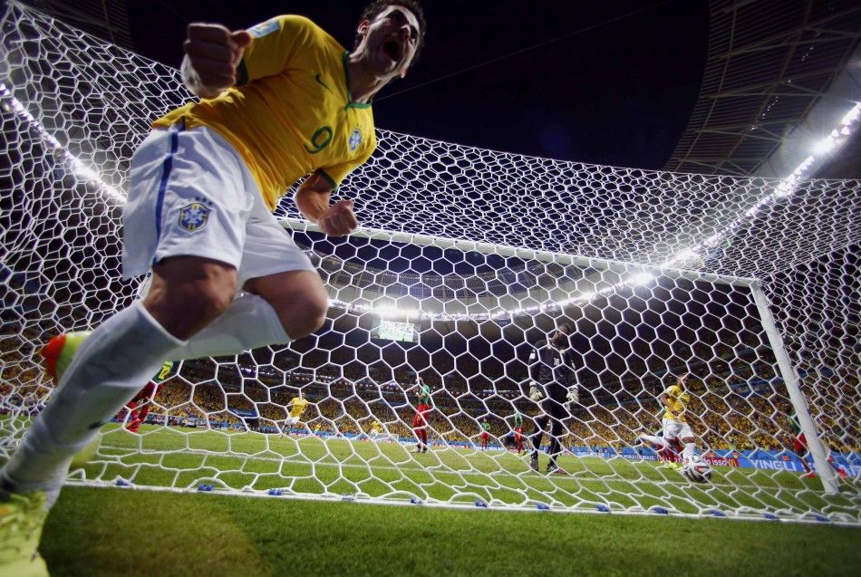 Brazils Fred Celebrates After Scoring Against Cameroon During Their 2014 World Cup Group A Soccer Match at the Brasilia National Stadium in Brasilia