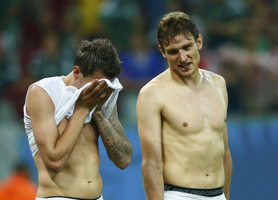 Croatias Mandzukic and Jelavic React After Losing Their 2014 World Cup Group A Soccer Match Against Mexico at the Pernambuco Arena in Recife