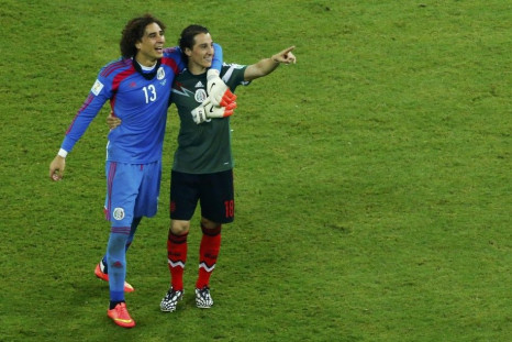 Mexico&#039;s goalkeeper Ochoa and Guardado celebrate after their 2014 World Cup Group A soccer match against Croatia in Recife