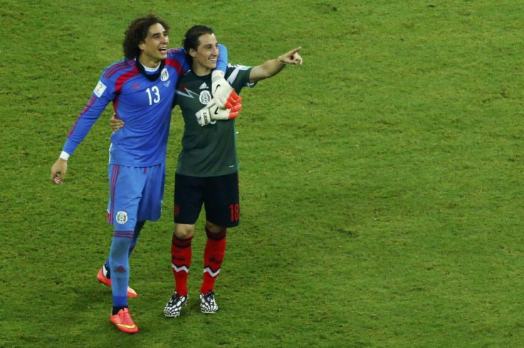 Mexico&#039;s goalkeeper Ochoa and Guardado celebrate after their 2014 World Cup Group A soccer match against Croatia in Recife