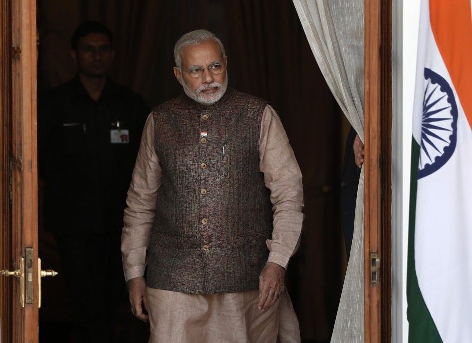 Indias Prime Minister Narendra Modi comes out of a meeting room to receive his Bhutanese counterpart Tshering Tobgay before the start of their bilateral meeting in New Delhi May 27, 2014.   REUTERSAdnan Abidi