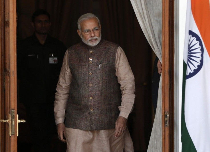 India's Prime Minister Narendra Modi comes out of a meeting room to receive his Bhutanese counterpart Tshering Tobgay before the start of their bilateral meeting in New Delhi May 27, 2014.   REUTERS/Adnan Abidi
