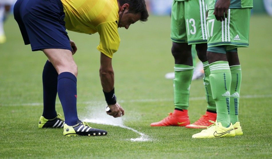 Referee Nicola Rizzoli L of Italy marks the ground 