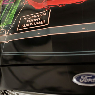 A sign is seen on the hood of a Ford Lightweight Concept car at the TechShop in San Francisco, California 