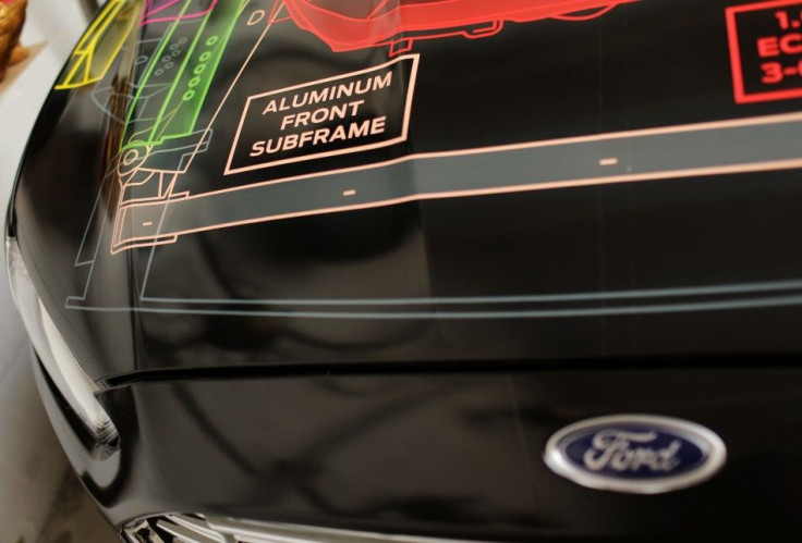 A sign is seen on the hood of a Ford Lightweight Concept car at the TechShop in San Francisco, California 