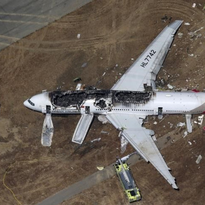 An Asiana Airlines Boeing 777 plane is seen in this aerial image after it crashed while landing at San Francisco International Airport in California on July 6, 2013. REUTERS/Jed Jacobsohn