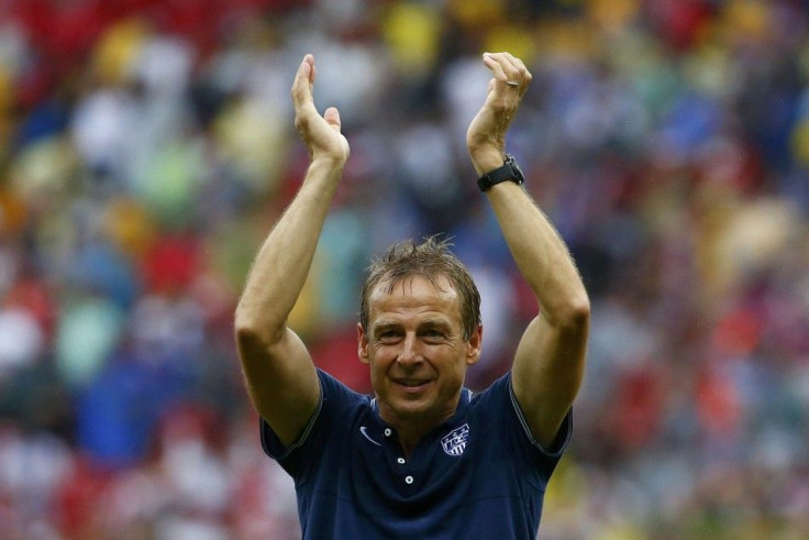 U.S. coach Klinsmann claps after their 2014 World Cup Group G soccer match with Germany at the Pernambuco arena in Recife