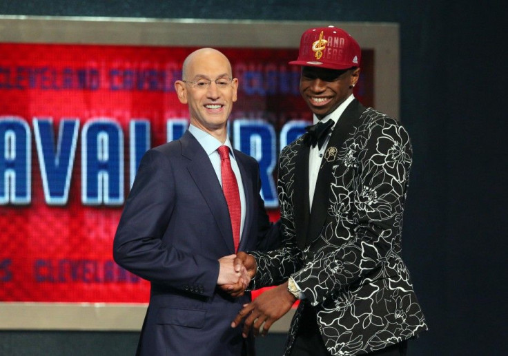 Jun 26, 2014; Brooklyn, NY, USA; Andrew Wiggins (Kansas) shakes hands with NBA commissioner Adam Silver after being selected as the number one overall pick to the Cleveland Cavaliers in the 2014 NBA Draft at the Barclays Center.