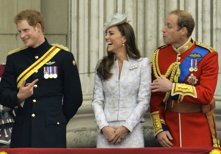 Britain&#039;s Prince Harry (L), Prince William, the Duke of Cambridge and his wife, Catherine, the Duchess of Cambridge share a light moment as they stand on the balcony of Buckingham Palace in the annual Trooping of the Colour ceremony to celebrate the 