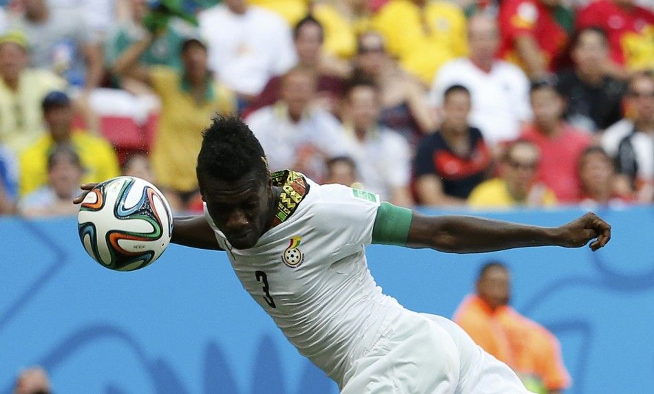 Ghanas Asamoah Gyan heads to score against Portugal 