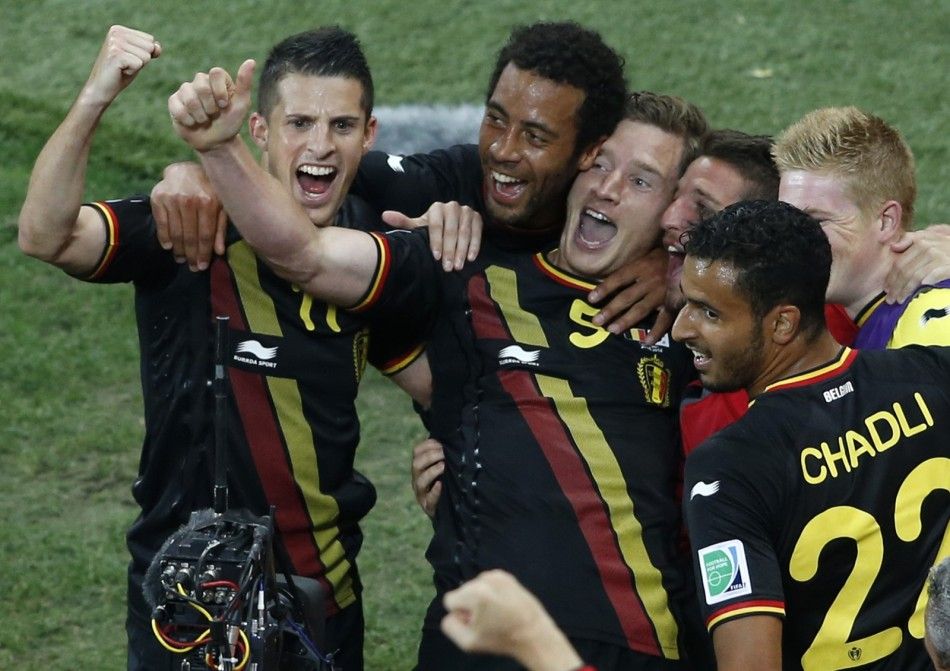 Belgiums Jan Vertonghen 5 celebrates his goal with team mates