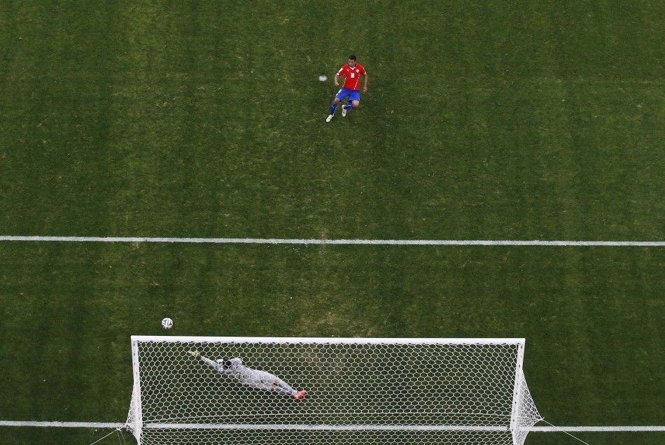 Chiles Gonzalo Jara takes a shot during a penalty shootout against Brazil,