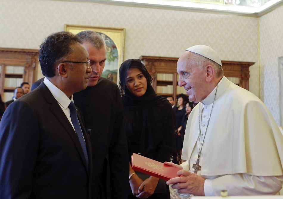 Pope Francis meets with Madagascars President Hery Rajaonarimampianina L and his wife Lalao 2nd R at the Vatican, June 28, 2014. REUTERSRiccardo De LucaPool VATICAN - Tags RELIGION POLITICS