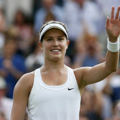 Eugenie Bouchard of Canada waves after defeating Daniela Hantuchova of Slovakia in their women&#039;s singles tennis match at the Wimbledon Tennis Championships, in London June 24, 2014. REUTERS/Stefan Wermuth (BRITAIN - Tags: SPORT TENNIS TPX IMAGES OF T