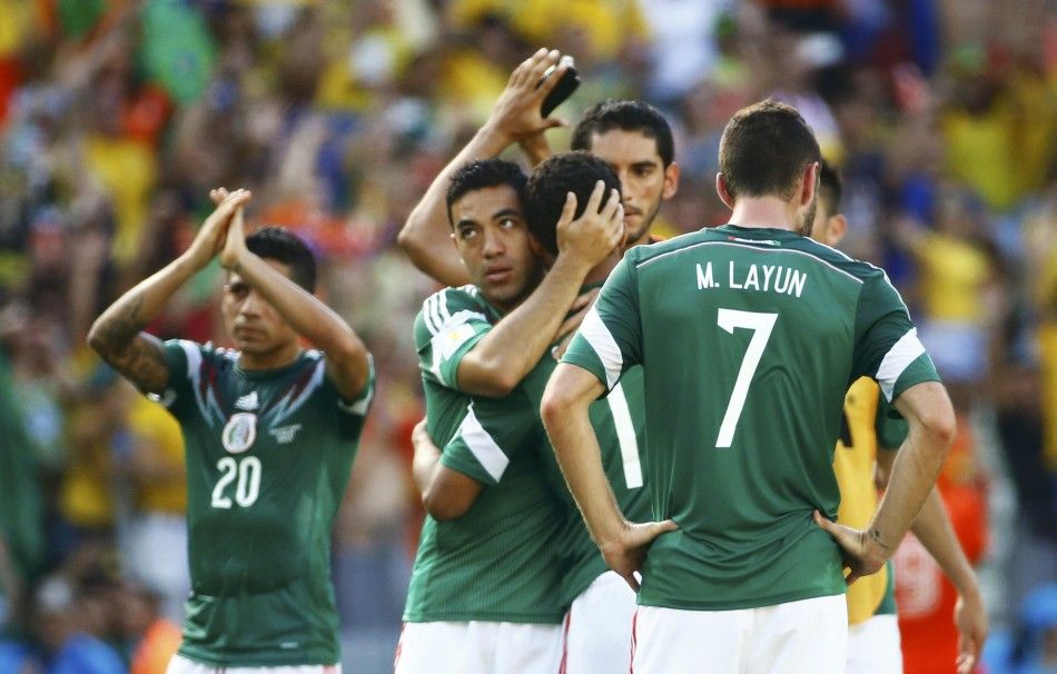 Mexicos national soccer players react after being defeated 