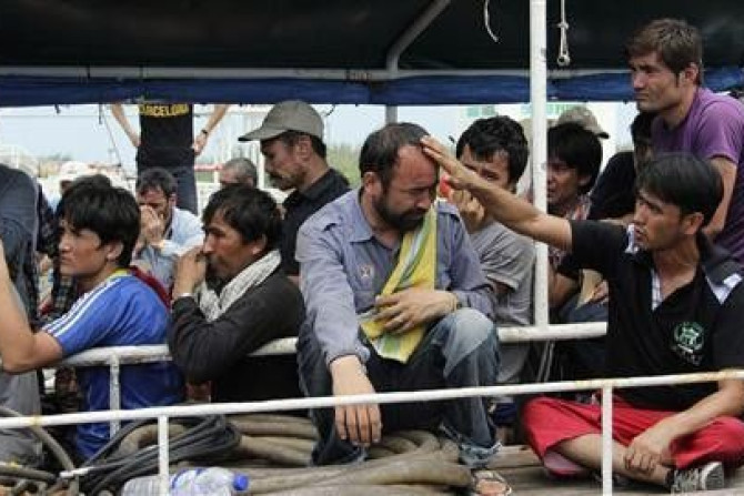 Asylum Seekers from Afghanistan, Iraq and Iran Cry as Indonesian Officers Force Them to Leave the Australian Vessel Hermia
