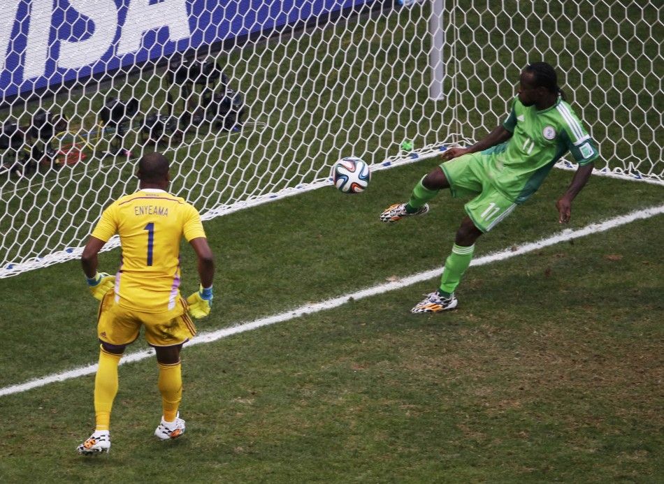 Nigerias Victor Moses R clears a shot by Frances Karim Benzema