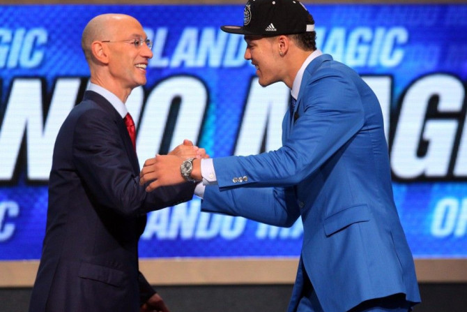 Jun 26, 2014; Brooklyn, NY, USA; Aaron Gordon (Arizona) shakes hands with NBA commissioner Adam Silver after being selected as the number four overall pick to the Orlando Magic in the 2014 NBA Draft at the Barclays Center.