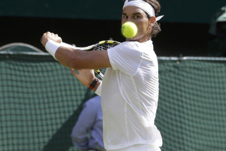 Rafael Nadal of Spain hits a return during his men's singles tennis match against Nick Kyrgios of Australia at the Wimbledon Tennis Championships, in London July 1, 2014. 