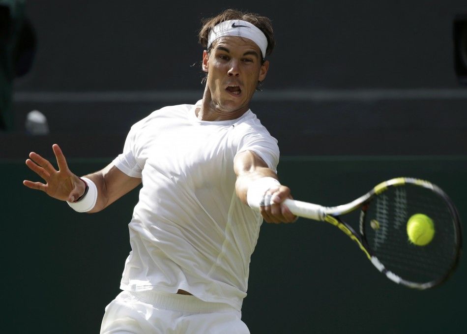 Rafael Nadal of Spain hits a return during his mens singles tennis match against Nick Kyrgios of Australia at the Wimbledon Tennis Championships, in London July 1, 2014. 