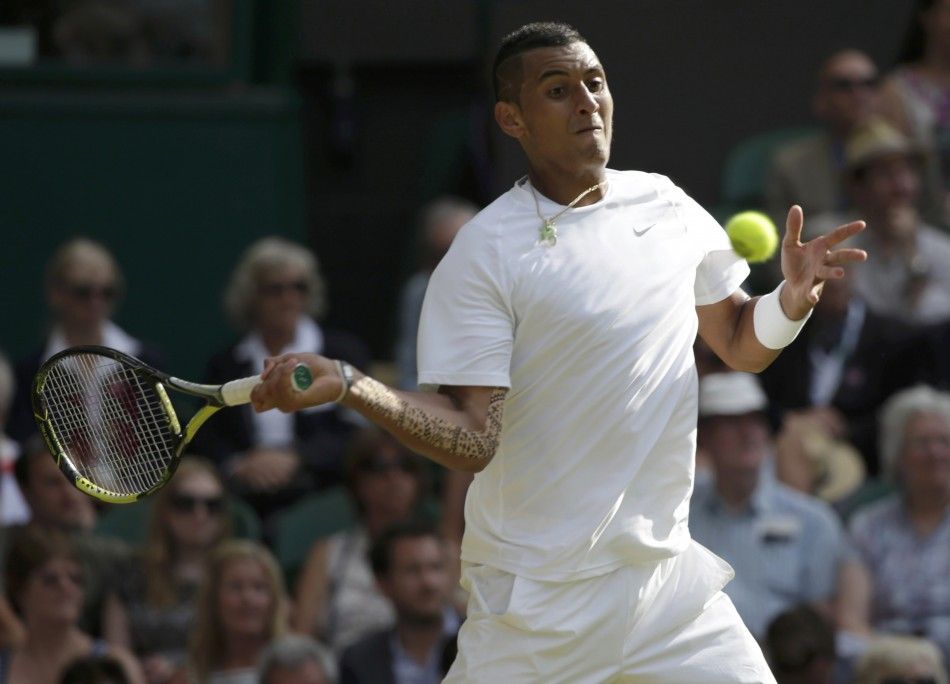 Nick Kyrgios of Australia hits a return during his mens singles tennis match against Rafael Nadal of Spain at the Wimbledon Tennis Championships, in London July 1, 2014. 