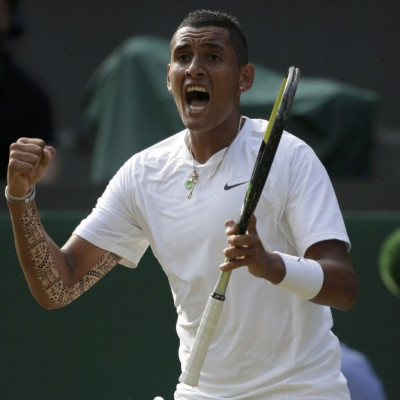 Nick Kyrgios of Australia reacts during his men's singles tennis match against Rafael Nadal of Spain at the Wimbledon Tennis Championships, in London July 1, 2014. 