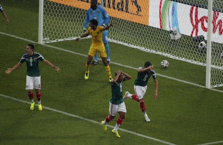 Mexico's Hector Herrera, Giovani Dos Santos and Hector Moreno react after their goal was disallowed during the 2014 World Cup Group A soccer match between Mexico and Cameroon at the Dunas arena in Natal June 13, 2014.