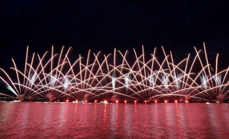 Fireworks light up the sky over the Neva River and the Peter and Paul Fortress during the annual school leavers&#039; night show in St. Petersburg, June 21, 2014.