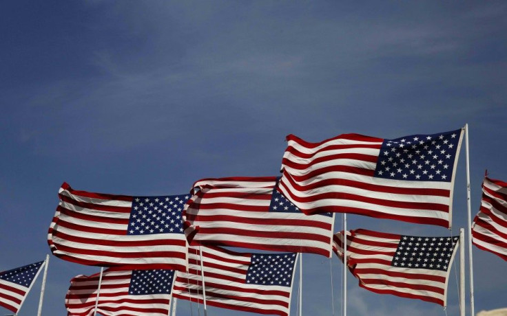 American flags flap in the wind at the Cannon Ball Flag Day celebration at the Cannon Ball Powwow Grounds on the Standing Rock Sioux Reservation in North Dakota