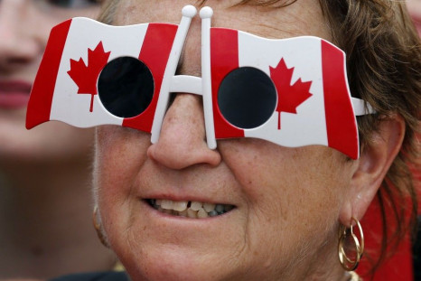 A Woman WearsSunglasses in the Shape of Canadian Flags During Canada Day Celebrations in Ottawa