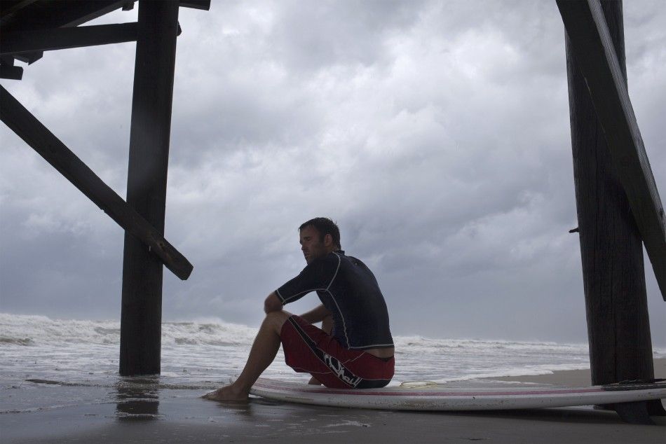 David Laing of Myrtle Beach waits for good waves from Hurricane Arthur, at Ocean Isle Beach, North Carolina July 3, 2014.  Arthur threatens to douse some July 4 holiday plans on the U.S. East Coast as officials ordered evacuations of some low-lying coasta