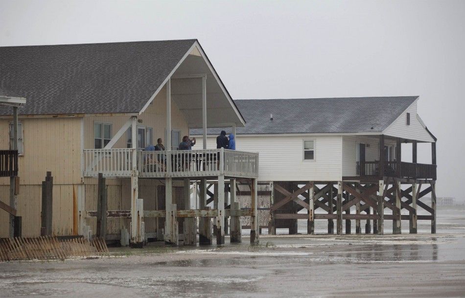 Tourists take photos of the surf from their beach houses during Hurricane Arthur, on the west end of Ocean Isle Beach, North Carolina July 3, 2014. REUTERSRandall Hill