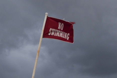 A &quot;No Swimming&quot; sign is pictured at Myrtle Beach State Park in preparation for the arrival of Hurricane Arthur, in Myrtle Beach, South Carolina July 3, 2014. Arthur became the first hurricane of the 2014 Atlantic season on Thursday after sparkin