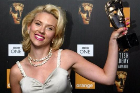 Scarlett Johansson holds her award for Best Actress for Lost in Translation at the BAFTA (British Academy of Film and Television Arts) awards in London, February 15, 2004.