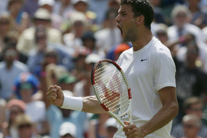 Grigor Dimitrov of Bulgaria reacts to winning the second set tie-break during his men&#039;s singles quarter-final tennis match against Andy Murray of Britain at the Wimbledon Tennis Championships, in London July 2, 2014.