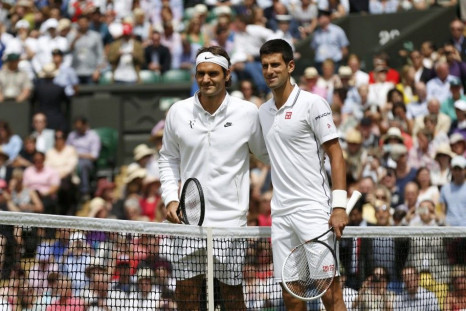Roger Federer of Switzerland (L) and Novak Djokovic of Serbia pose for a photograph before their men's singles final tennis match at the Wimbledon Tennis Championships, in London July 6, 2014.